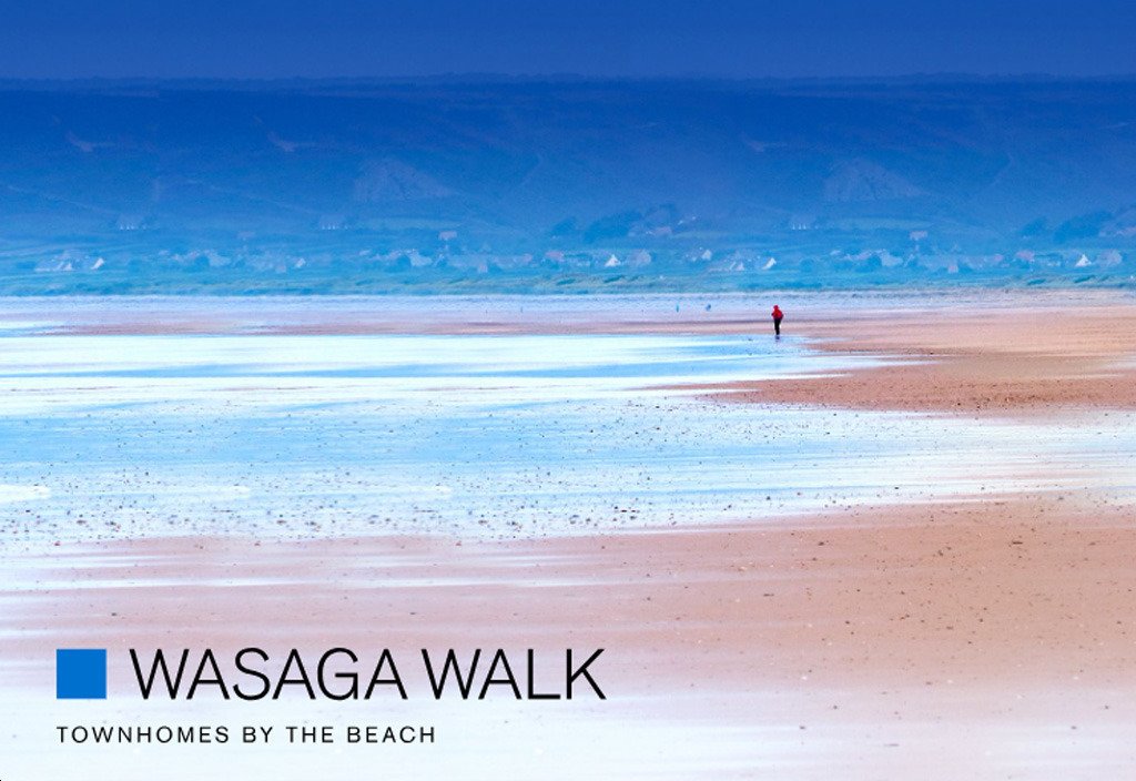 Scenic view of Wasaga Beach with a lone walker and distant cottages, promoting Wasaga Walk Townhomes by the Beach